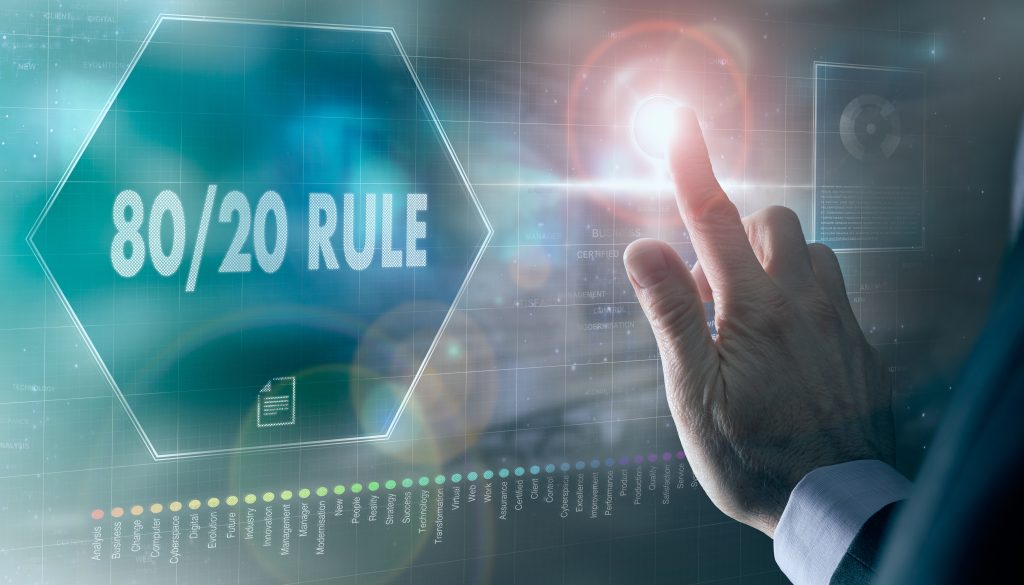 A businessman controlling a futuristic display with a 80/20 Rule business concept on it.